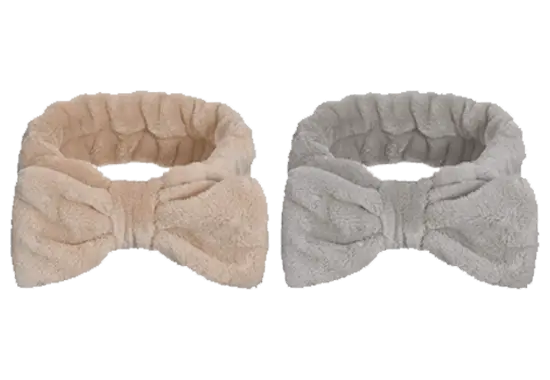 Soft plush headbands in beige and gray for spa or beauty treatments.